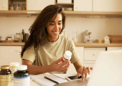 A young woman checks if combining Glutathione and Vitamin C is beneficial