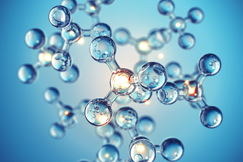 Scientific illustration of interconnected molecular structures in blue tones, representing mineral chelation and ingredient technology